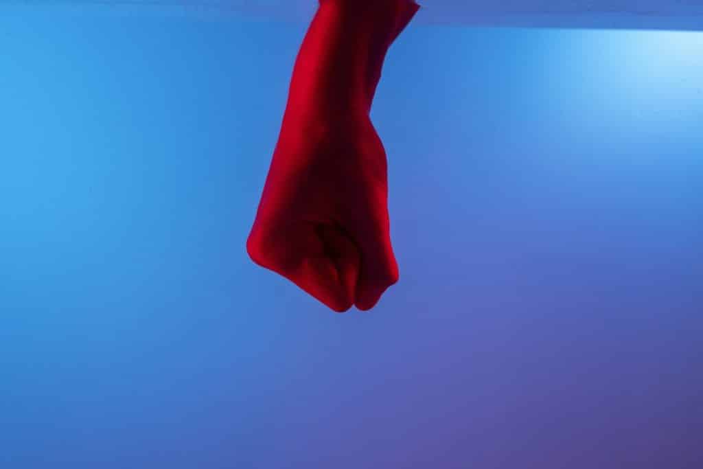 red fist against blue background