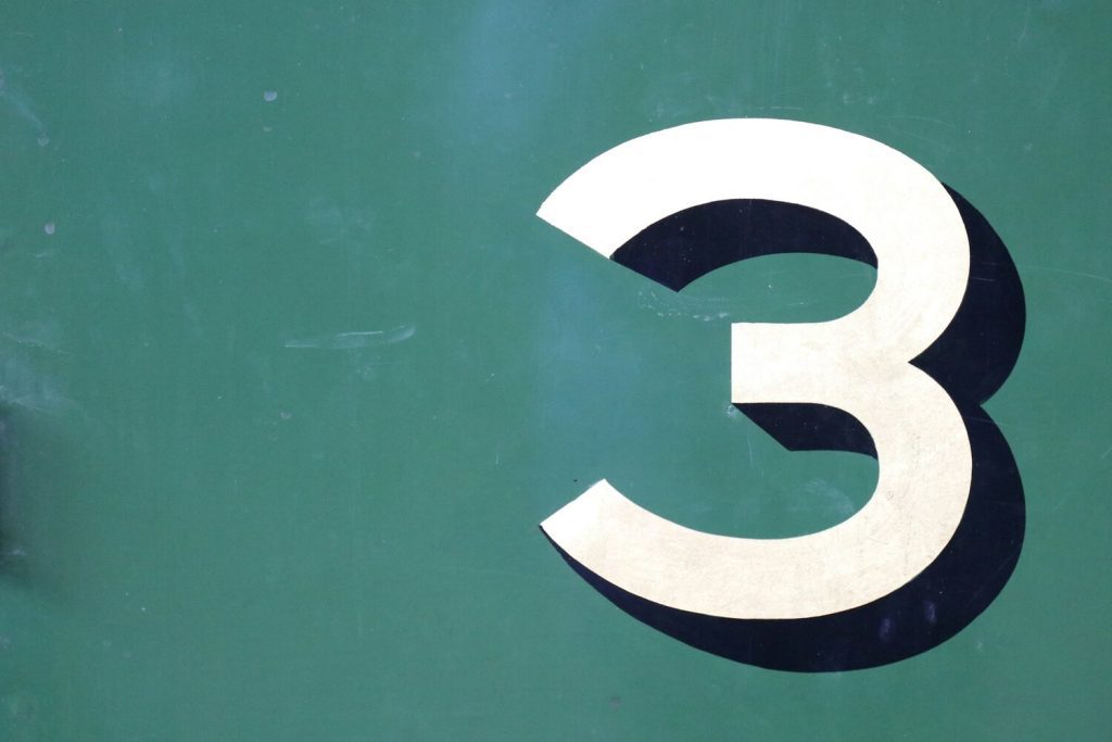 the number 3 against a green background